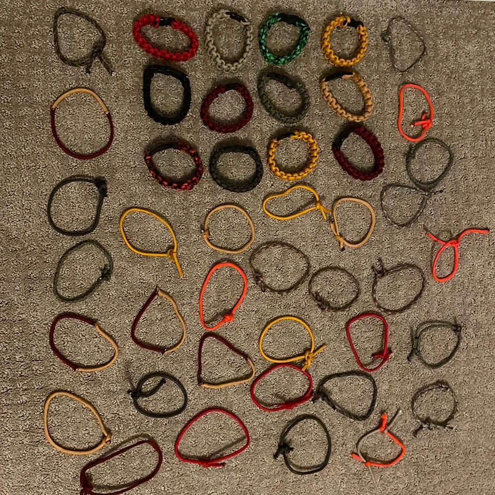 44 parachute cord bracelets (some are adjustable) different sizes